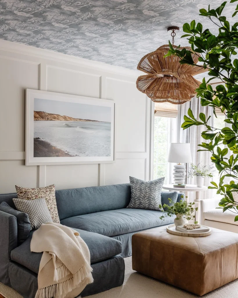 Coastal Boho Living Room with Wallpapered Ceiling and Scalloped Rattan Chandelier