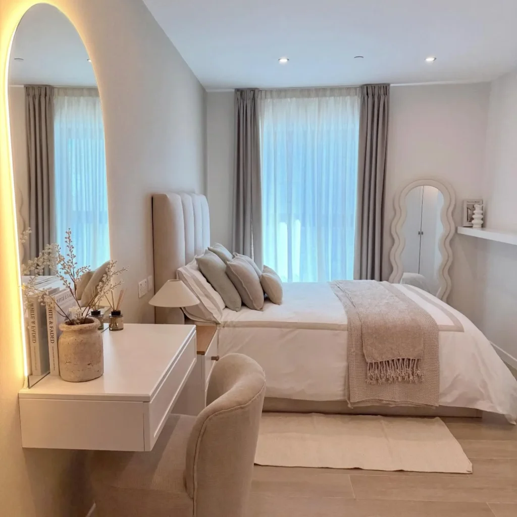 Contemporary Bedroom With LED Arch Mirror and Floating Vanity
