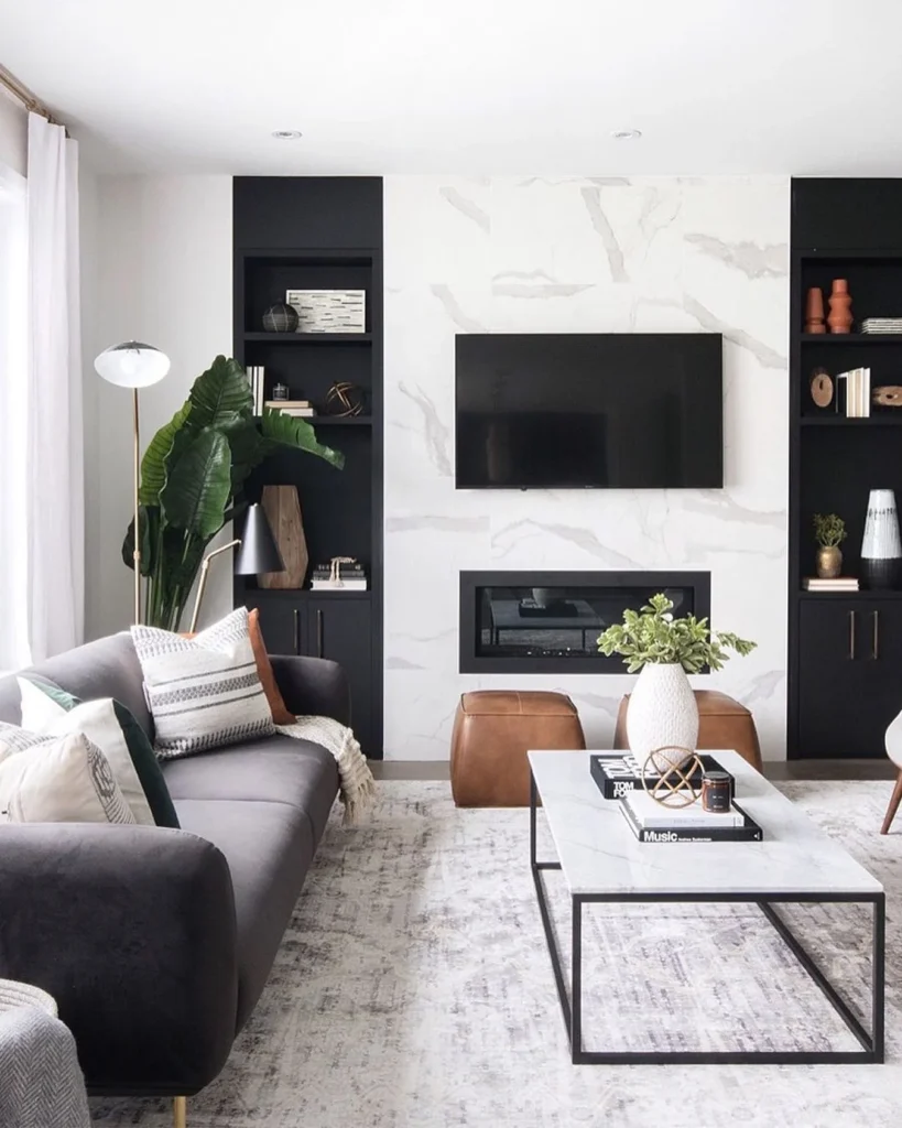 Contemporary Living Room With Marble Fireplace Wall and Black Built-Ins