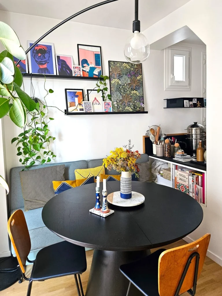 Dining Nook With Sofa Banquette and Picture Ledge Gallery Wall