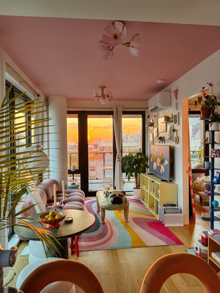 Maximalist Small Apartment With Pink Ceiling and Rainbow Rug