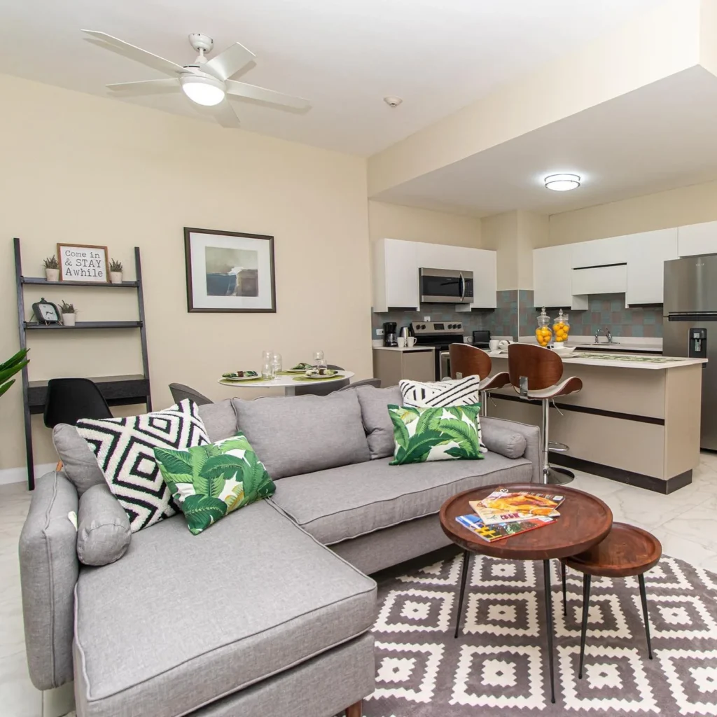 Open Kitchen and Living Room Layout With Peninsula Bar Seating