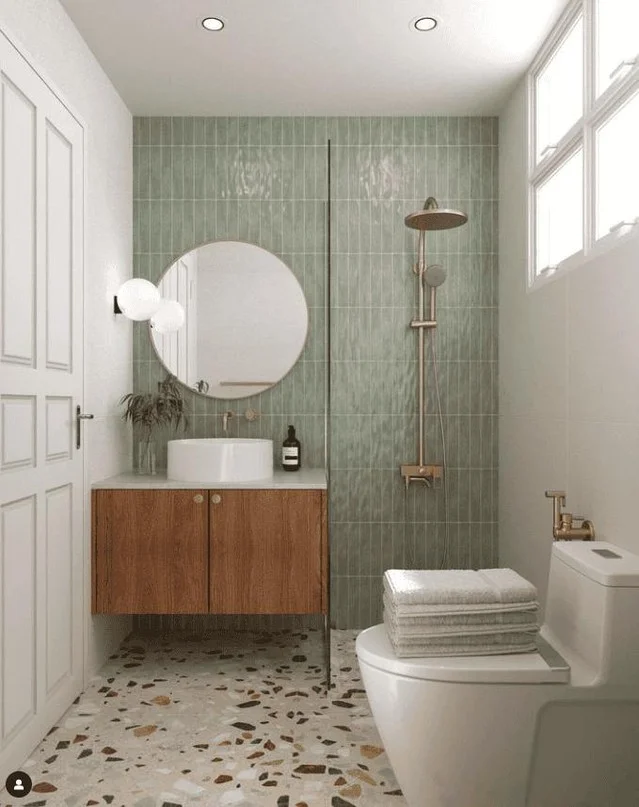 Pair Sage Green Vertical Tile With Terrazzo Floors for a Retro-Modern Bathroom