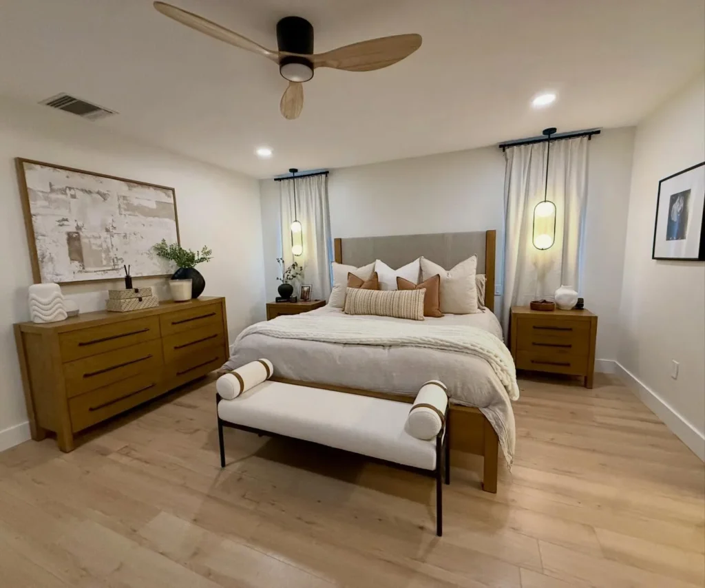 Warm Oak Bedroom With Pendant Bedside Lights and Upholstered Headboard