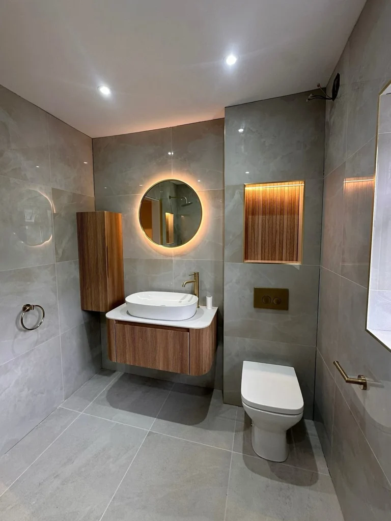 Warm Wood and Grey Stone Bathroom with Brass Accents